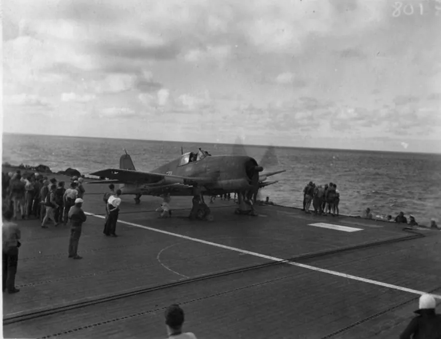 Hellcat-sits-on-the-flight-deck-with-its-engine-running-and-chocks-in-place-somewhere-North-of-the-Philippines